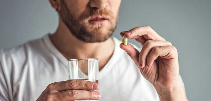 A man takes drugs to treat prostatitis
